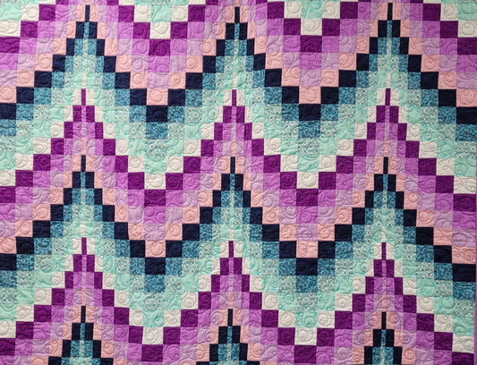 Bargello quilt in shades of purple and aqua