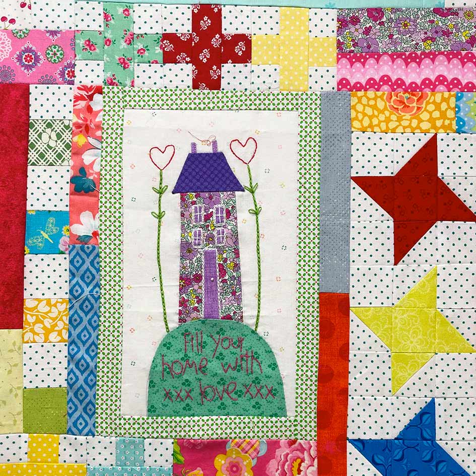 Patchwork sampler 'Fill your home with love' a home on a hill