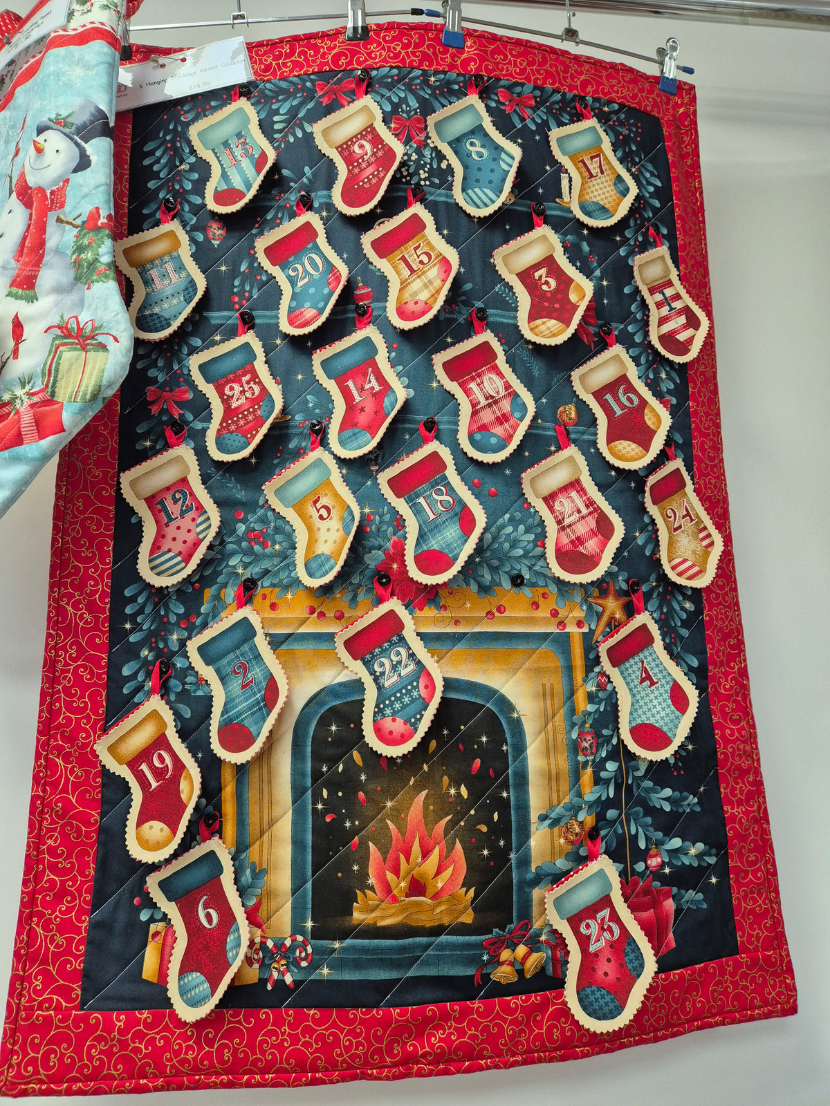 Stocking and fire themed advent calendar panel