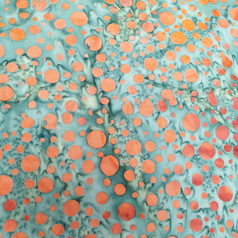 Batik orange dots on seagreen background