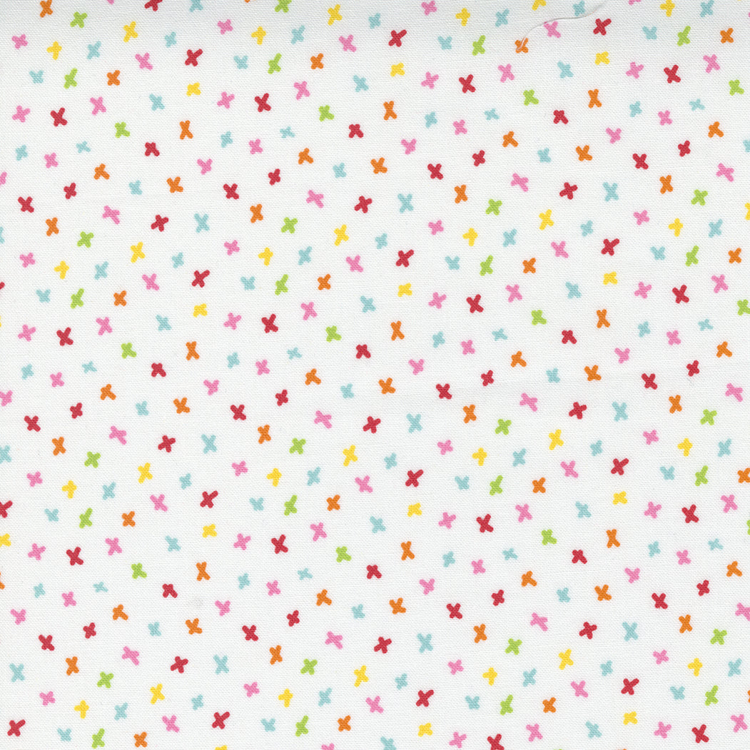 Moda fabric with coloured simple star shapes on a white background from the Creativity Glows range