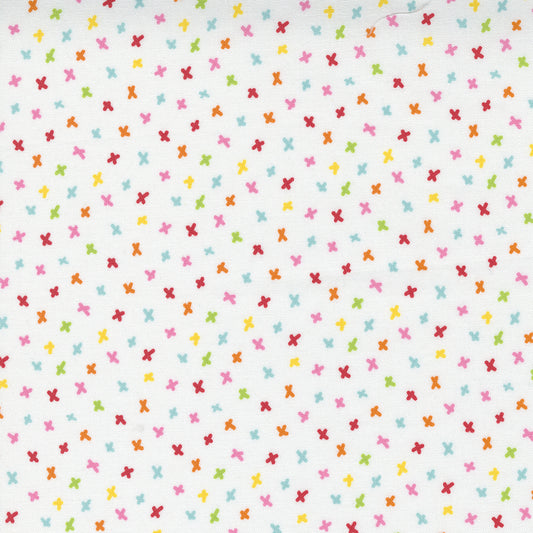 Moda fabric with coloured simple star shapes on a white background from the Creativity Glows range